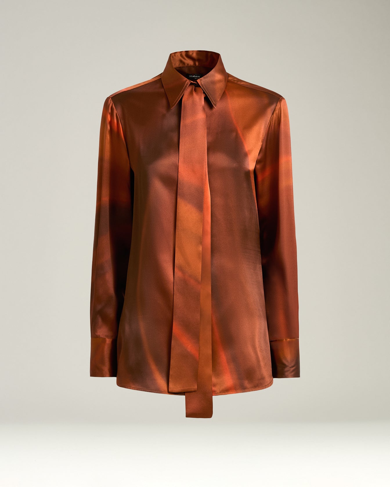 women's rust-colored printed silk blouse with tie neck
