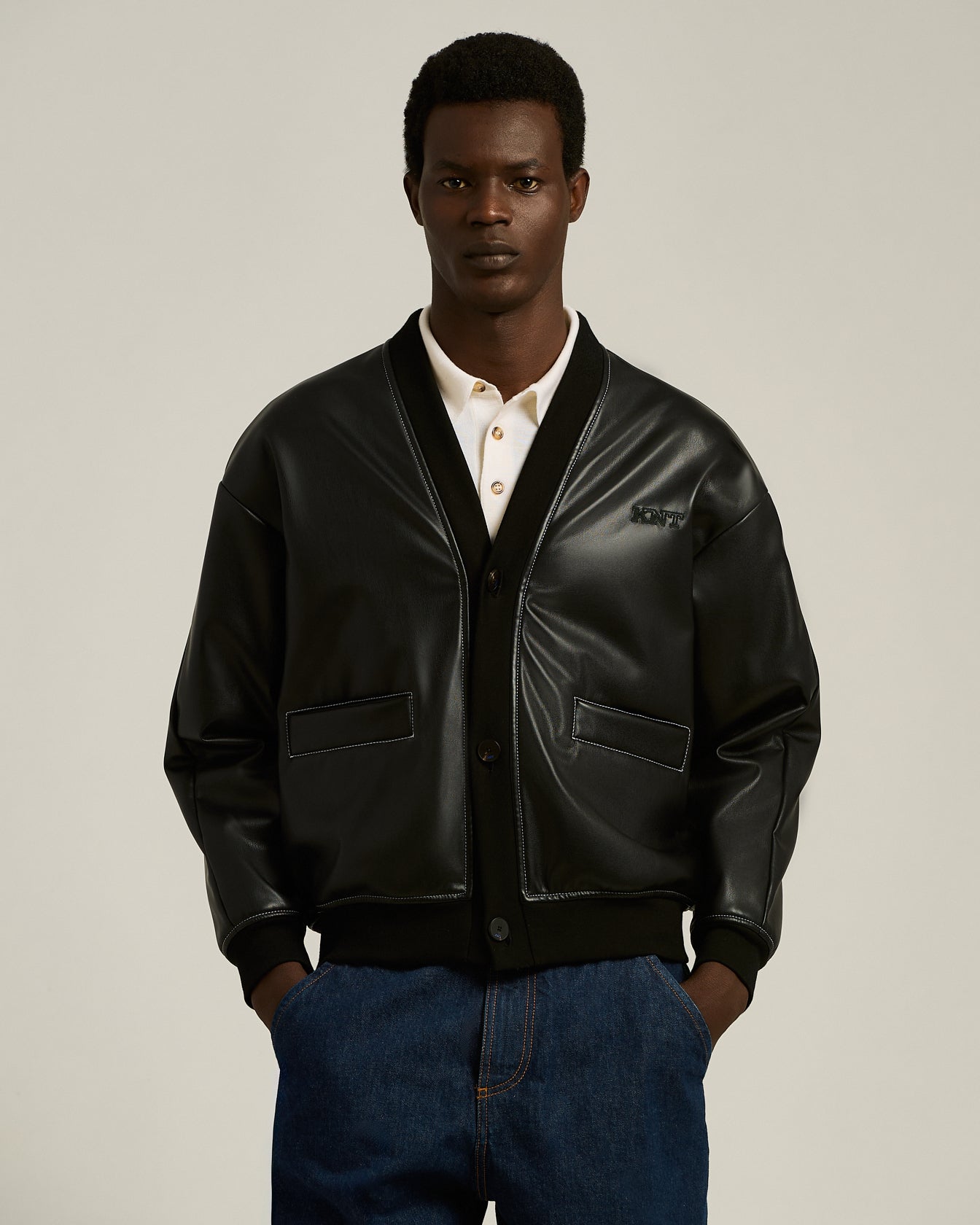 LEATHER-EFFECT BOMBER JACKET WITH A CONTEMPORARY SILHOUETTE