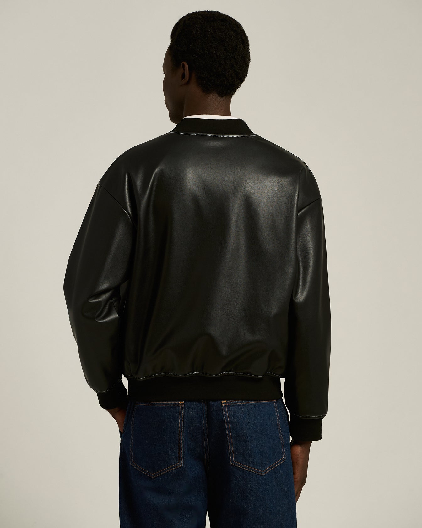 LEATHER-EFFECT BOMBER JACKET WITH A CONTEMPORARY SILHOUETTE