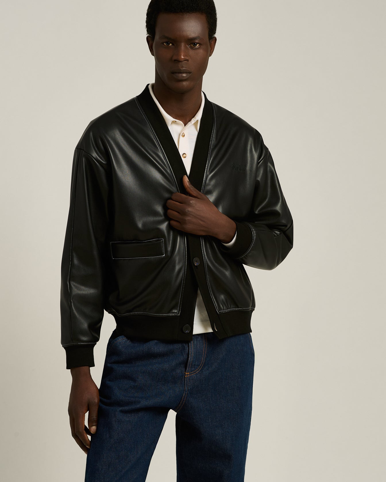 LEATHER-EFFECT BOMBER JACKET WITH A CONTEMPORARY SILHOUETTE